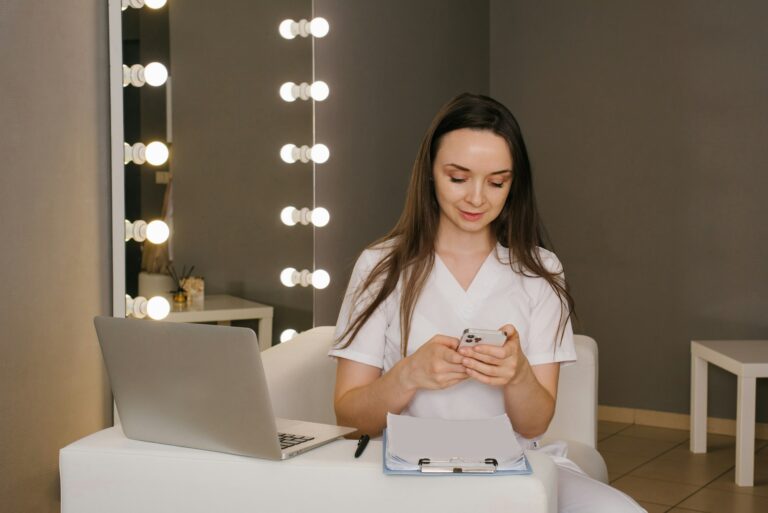 Woman Cosmetologist Calls the Client to Confirm the Appointment or Conducts an Online Consultation